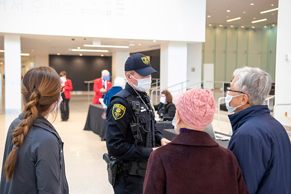 Cleveland Clinic Police Officer talking to patients at our main campus